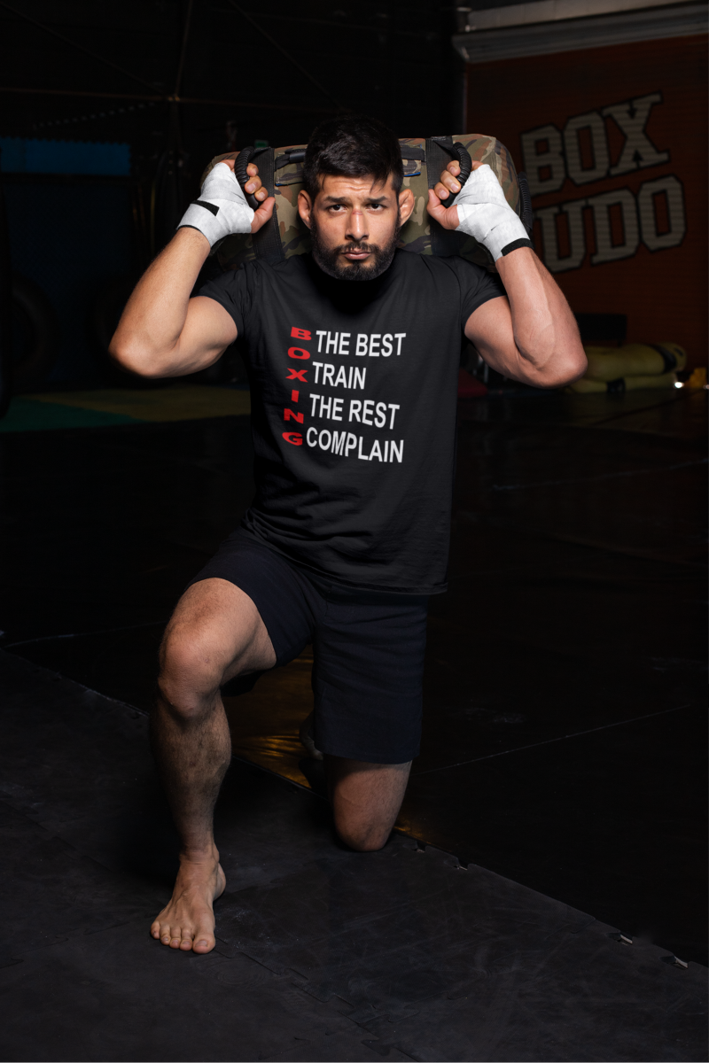 t-shirt-mockup-of-an-mma-fighter-kneeling-at-a-boxing-gym-crna.png 